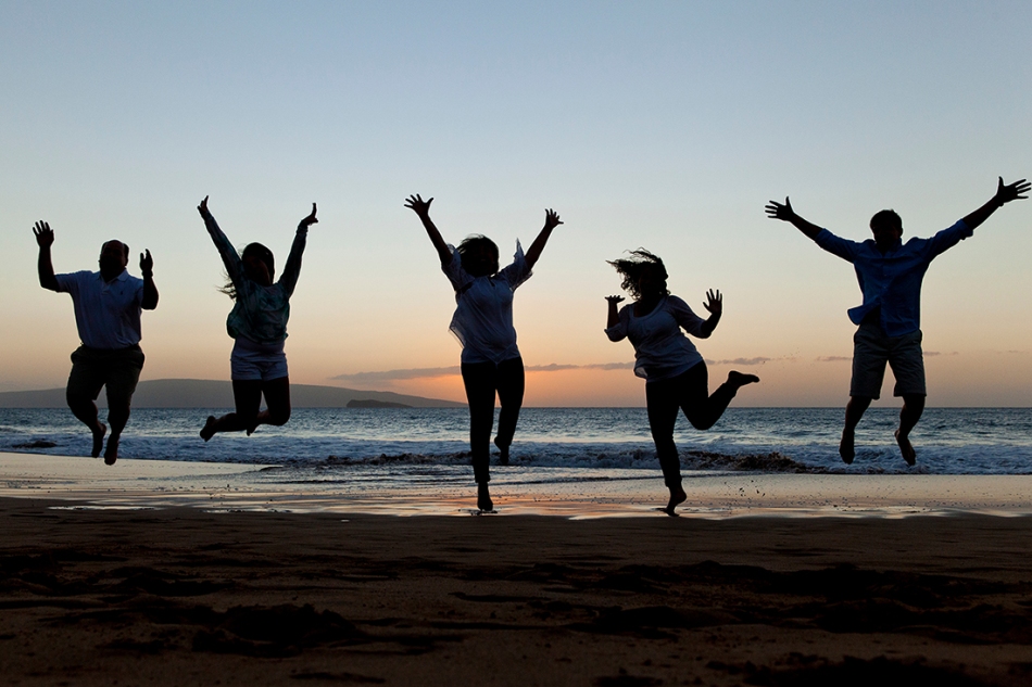Jumping family silhouetted against Maui's beautiful Wailea sunsets.